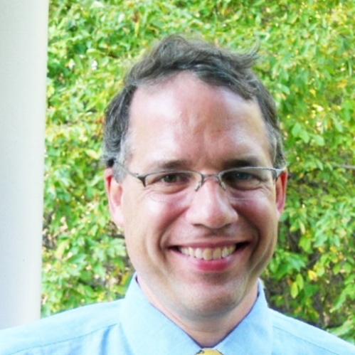 Head shot of male with short hair and eyeglasses.