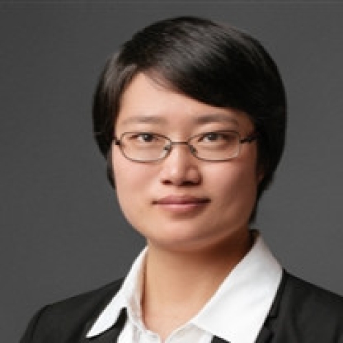 Head shot of Asian woman with black hair and eyeglasses.