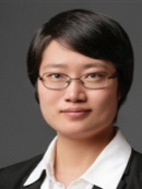 Head shot of Asian woman with black hair and eyeglasses.