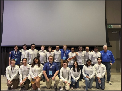 2 rows students front row is kneeling and back row is standing